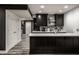 Kitchen area featuring dark cabinets, light countertops and stainless steel appliances at 350 N Meridian St # 606/607, Indianapolis, IN 46204
