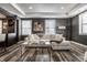 A modern living room features a white sofa, art, sleek flooring, and soft lighting at 350 N Meridian St # 606/607, Indianapolis, IN 46204