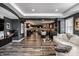Bright open-concept living space with plank floors, modern furniture and flow to the dining and kitchen areas at 350 N Meridian St # 606/607, Indianapolis, IN 46204