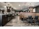 Spacious living space with plank floors, modern dining, kitchen, and sitting area with modern furnishings at 350 N Meridian St # 606/607, Indianapolis, IN 46204