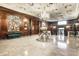 Impressive lobby adorned with dark wood paneling, marble floors, and a statement chandelier at 350 N Meridian St # 606/607, Indianapolis, IN 46204