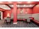 Cozy lounge featuring patterned banquette seating, warm red walls, and decorative lighting at 350 N Meridian St # 606/607, Indianapolis, IN 46204