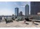Spacious roof deck featuring comfortable seating and stunning views of the downtown skyline at 350 N Meridian St # 606/607, Indianapolis, IN 46204