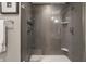 Contemporary shower with glass enclosure, rainfall showerhead, and built-in shelving for toiletries at 350 N Meridian St # 606/607, Indianapolis, IN 46204