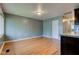 Bright, airy living area featuring sleek wood floors and soothing grey wall paint at 3513 Ireland Dr, Indianapolis, IN 46235