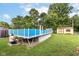 Enjoy outdoor fun with this above ground pool, shed, and spacious backyard, perfect for recreation and relaxation at 3515 Lindenwald Dr, Indianapolis, IN 46217