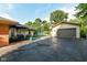 Expansive backyard featuring a patio, a garage, an above-ground pool, and mature trees at 3515 Lindenwald Dr, Indianapolis, IN 46217
