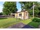 Quaint backyard storage shed in a fenced-in yard, perfect for organization at 3515 Lindenwald Dr, Indianapolis, IN 46217