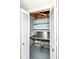 Practical basement closet with built-in shelving and utility sink, offering ample storage solutions at 3515 Lindenwald Dr, Indianapolis, IN 46217