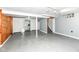 A large unfinished basement space featuring storage and access to a staircase at 3515 Lindenwald Dr, Indianapolis, IN 46217
