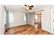 Bedroom featuring wood floors, a barn door closet, and sun-filled windows at 3515 Lindenwald Dr, Indianapolis, IN 46217
