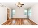 Spacious bedroom with wood floors, large windows, and a walk-in closet at 3515 Lindenwald Dr, Indianapolis, IN 46217