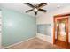 A cozy bedroom featuring a ceiling fan and a view of an adjoining bathroom at 3515 Lindenwald Dr, Indianapolis, IN 46217