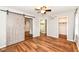 Cozy bedroom with hard wood floors, barn door closet, and en-suite bathroom at 3515 Lindenwald Dr, Indianapolis, IN 46217