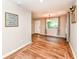Bright dining room featuring hardwood floors and an updated light fixture at 3515 Lindenwald Dr, Indianapolis, IN 46217
