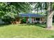 Charming brick home with a well-maintained lawn and cozy front porch at 3515 Lindenwald Dr, Indianapolis, IN 46217