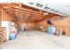 Spacious unfinished garage with wood framing, offering potential for customization and ample storage at 3515 Lindenwald Dr, Indianapolis, IN 46217