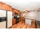 Large kitchen with black appliances, ample cabinet space and island with bar seating at 3515 Lindenwald Dr, Indianapolis, IN 46217