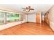 Inviting living room with hardwood floors and large windows overlooking the front yard at 3515 Lindenwald Dr, Indianapolis, IN 46217