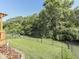 Spacious backyard featuring lush green lawn, privacy fence, and mature trees creating a serene outdoor oasis at 3962 Kristi Way, Greenwood, IN 46142