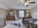Bedroom with a ceiling fan, curtains, and wooden dresser at 3962 Kristi Way, Greenwood, IN 46142