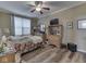 Cozy bedroom with wood flooring and a ceiling fan at 3962 Kristi Way, Greenwood, IN 46142