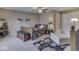 Bedroom featuring a ceiling fan, bench, accent chair, and staircase at 3962 Kristi Way, Greenwood, IN 46142