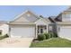 Charming home featuring a brick facade, attached garage, and well-manicured lawn with mature landscaping at 3962 Kristi Way, Greenwood, IN 46142