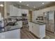 Well-equipped kitchen features a center island, stainless steel appliances, and ample cabinet space at 3962 Kristi Way, Greenwood, IN 46142