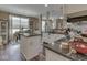 Open-concept kitchen with stone countertops, stainless appliances and a breakfast nook with seating at 3962 Kristi Way, Greenwood, IN 46142