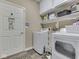 Laundry room with washer, dryer, overhead cabinets, and shelving at 3962 Kristi Way, Greenwood, IN 46142