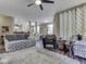 Spacious living room offering a view of the kitchen, ample seating, and stylish decor at 3962 Kristi Way, Greenwood, IN 46142