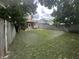 Large, grassy backyard enclosed by a wooden fence, offering privacy at 4130 Rookwood Ave, Indianapolis, IN 46208