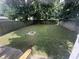 Spacious backyard with a well-maintained lawn and a fire pit area at 4130 Rookwood Ave, Indianapolis, IN 46208