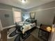 Cozy bedroom with a decorative rug, a desk, and serene wall art at 4130 Rookwood Ave, Indianapolis, IN 46208