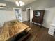 Dining room with wooden table, hutch, and hardwood floors with view of the kitchen at 4130 Rookwood Ave, Indianapolis, IN 46208