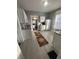 Bright kitchen featuring white cabinets, modern appliances, and a view into the dining area at 4130 Rookwood Ave, Indianapolis, IN 46208