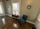 Stylish chair and table with lamp in a living area with hardwood flooring at 4130 Rookwood Ave, Indianapolis, IN 46208