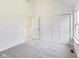 Bright bedroom featuring neutral carpeting, white walls, and a big window for lots of natural light at 430 N Keystone Ave, Indianapolis, IN 46201