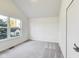 Bright bedroom featuring neutral carpeting, white walls, and a big window for lots of natural light at 430 N Keystone Ave, Indianapolis, IN 46201