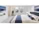 Bright bedroom with modern decor, hardwood floors, and natural lighting from the big window at 430 N Keystone Ave, Indianapolis, IN 46201