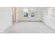 A bright bedroom featuring neutral carpeting, white walls, and a big window for lots of natural light at 430 N Keystone Ave, Indianapolis, IN 46201