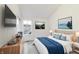 Comfortable primary bedroom with white walls, bright window, and stylish decor at 430 N Keystone Ave, Indianapolis, IN 46201