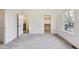 Bright bedroom with neutral carpet, closet, and bathroom access at 430 N Keystone Ave, Indianapolis, IN 46201