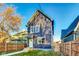 Charming two-story home featuring a well maintained lawn and lovely landscaping at 430 N Keystone Ave, Indianapolis, IN 46201