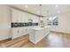 Stylish kitchen with white cabinets, island, and black backsplash at 430 N Keystone Ave, Indianapolis, IN 46201