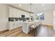 Stylish kitchen with white cabinets, island, and black backsplash at 430 N Keystone Ave, Indianapolis, IN 46201