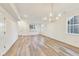Spacious open-concept living area with wood floors and natural light at 430 N Keystone Ave, Indianapolis, IN 46201