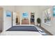 Decorated bedroom with ensuite bathroom, closet, and natural light at 430 N Keystone Ave, Indianapolis, IN 46201