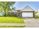 Attractive single-story home with brick accents, a well-kept lawn, and an attached garage at 431 Alton Dr, Greenwood, IN 46143